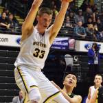Ninilchik&rsquo;s Austin White puts down a two-handed dunk against the Aniak Halfbreeds, March 15, 2017, at the Class 1A state basketball tournament at the Alaska Airlines Center in Anchorage. (Photo by Joey Klecka/Peninsula Clarion)
