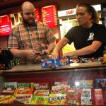 Orca Theatre managers Jordan Gruber (left) and Sarah Covault sort candy into bunches of ten to stock the Orca&rsquo;s concession stand on Monday, Dec. 25, 2017 at the Orca Theatre on Kalifornsky Beach Road near Kenai, Alaska. The two managers crewed the theatre on Christmas day, until other employees arrived for the bigger evening showings. (Photo by Ben Boettger/Peninsula Clarion)