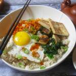 This Dec. 8 photo shows a Korean grain bowl in New York. This dish is from a recipe by Sara Moulton. (Sara Moulton via AP)