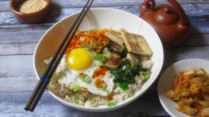 This Dec. 8 photo shows a Korean grain bowl in New York. This dish is from a recipe by Sara Moulton. (Sara Moulton via AP)