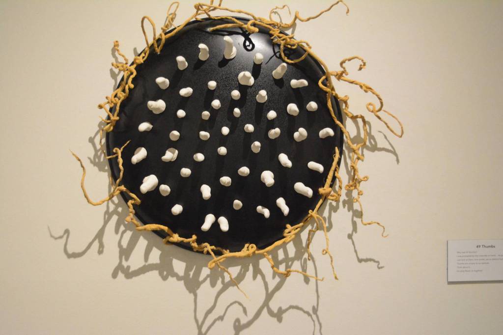 &ldquo;49 Thumbs&rdquo; uses plaster castings of the thumbers of people who participated in the square root of 49 art work. (Photo by Michael Armstrong, Homer News)