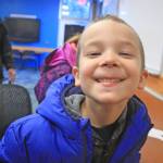 Phillip Larson, 6, takes a break from crafts at the Kenai National Wildlife Refuge Visitor Center on Dec. 27. The visitor center hosted an afternoon of family-friendly activities. (Photo by Erin Thompson/Peninsula Clarion)