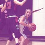 Nikiski&rsquo;s Kaitlyn Johnson tries to find a way around Kenai Central&rsquo;s Brooke Satathite on Thursday, Jan. 4, 2017, at Nikiski High School. (Photo by Jeff Helminiak/Peninsula Clarion)