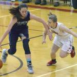 Soldotna&rsquo;s Danica Schmidt protects the ball from Kenai Central&rsquo;s Hayley Maw on Tuesday, Jan. 16, 2018, at Cliff Massie Court at Kenai Central High School. (Photo by Jeff Helminiak/Peninsula Clarion)