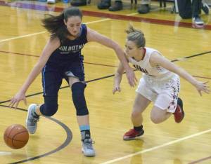 Soldotna&rsquo;s Danica Schmidt protects the ball from Kenai Central&rsquo;s Hayley Maw on Tuesday, Jan. 16, 2018, at Cliff Massie Court at Kenai Central High School. (Photo by Jeff Helminiak/Peninsula Clarion)