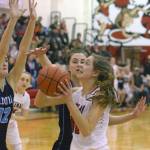 Soldotna&rsquo;s Danica Schmidt and Aliann Schmidt try to stop Kenai Central&rsquo;s Brooke Satathite on Tuesday, Jan. 16, 2018, on Cliff Massie Court at Kenai Central High School. (Photo by Jeff Helminiak/Peninsula Clarion)
