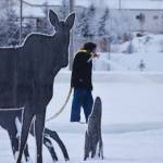 A Soldotna Parks & Recreation worker sprays a layer of water to be frozen into a skating rink Thursday at Soldotna Creek Park. (Photo by Joey Klecka/Peninsula Clarion)