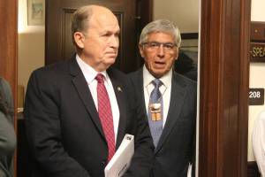 Alaska Gov. Bill Walker, left, and Lt. Gov. Byron Mallott wait for a joint session of the Alaska Legislature to convene Thursday in Juneau. In Walker&rsquo;s annual State of the State address, he told lawmakers Alaska&rsquo;s prosperity hinges on solving Alaska&rsquo;s multibillion dollar budget deficit. (AP Photo/Mark Thiessen)