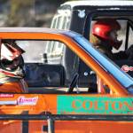 Racecar drivers wait for the flag to drop before a race on the ice track atop a frozen lake at the Decanter Inn on Sunday, Jan. 22, 2018 in Kasilof, Alaska. Every Sunday in the winter, the Decanter Inn hosts Peninsula Ice Racing events for drivers to try their hand at the frozen track on the shallow lake at the bottom of the hill behind the inn. The racers can use studded tires on their front wheels only and equip the sides of their vehicles with bumpers as other vehicles are likely to slip and slide into them. Spinning out is common. A tow truck waits on the sidelines to retrieve drivers who get stuck on the berms alongside the track. Fans gathered Sunday despite the cold to cheer the racers on. The men race in the morning, followed by the women&rsquo;s races in the afternoon. (Photo by Elizabeth Earl/Peninsula Clarion)