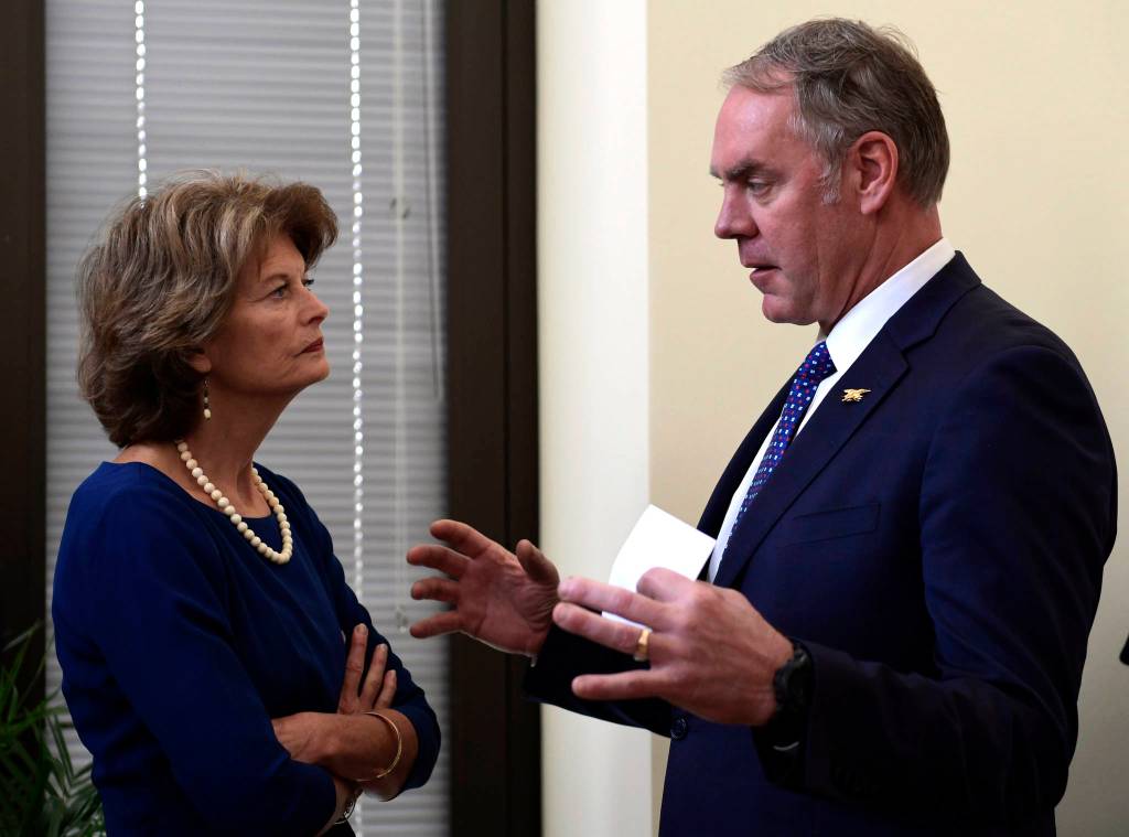 Sen. Lisa Murkowski, R-Alaska, left, talks with Interior Secretary Ryan Zinke, right, before an event in her office on Capitol Hill in Washington, Monday. (AP Photo/Susan Walsh)