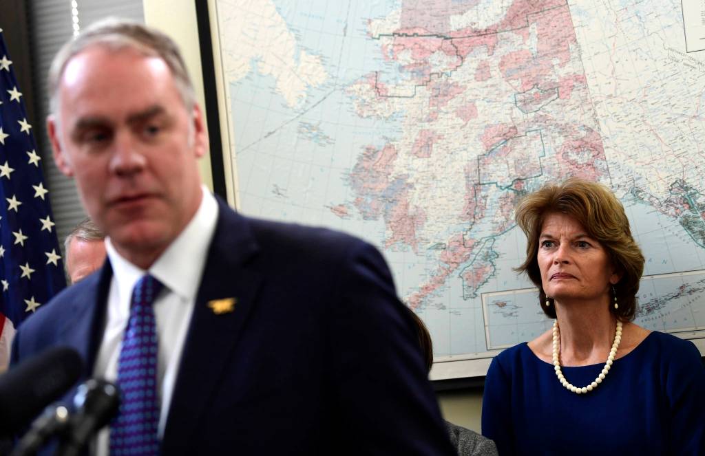 Sen. Lisa Murkowski, R-Alaska, right, listens as Interior Secretary Ryan Zinke, right, speaks during an event in her office on Capitol Hill in Washington, Monday, Jan. 22, 2018. Murkowski was joined by other Alaskan officials regarding the Interior Department&rsquo;s decision to the construction of a road through a national wildlife refuge in Alaska. The road would connect the communities of King Cove and Cold Bay, which has an all-weather airport needed for emergency medical flights. (AP Photo/Susan Walsh)