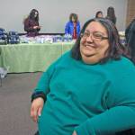 Krissanna French shows off her new haircut. French and her family attended the Jan. 24 Project Homeless to seek housing housing help. (Photo by Erin Thompson/Peninsula Clarion)