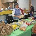 Volunteers staff the kitchen and buffet line at the Jan. 24 Project Homeless Connect at the Soldotna Regional Sports Complex. The annual event gathers service providers, nonprofits and volunteers to support members of the homeless community and those in need. (Photo by Erin Thompson/Peninsula Clarion)