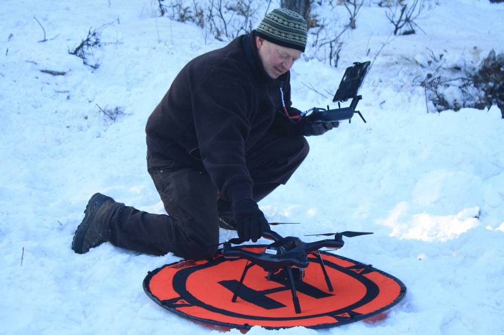 Kenai National Wildlife Refuge ecologist Mark Laker preps a 3DR surveillance drone equipped with a heat sensor during a prescribed burning on Thursday, Feb. 1. (Photo by Erin Thompson/Peninsula Clarion)