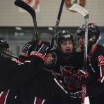 Kenai Central&rsquo;s Nate Beiser (center) congratulates teammate Jordan Knudson for scoring a goal against Palmer, Thursday evening in a North Star Conference tournament semifinal at the Soldotna Regional Sports Complex. (Photo by Joey Klecka/Peninsula Clarion)