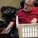 Chuck Davis shreds paper at the Frontier Community Services office in Soldotna on Jan. 18, 2018, his last day of work after 33 years with the non-profit agency. (Photo by Kat Sorensen/Peninsula Clarion)