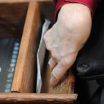 Chuck Davis uses a specialized basket and shredder to shred papers at Frontier Community Services, a non-profit organization dedicated to helping disabled individuals remain active and involved in their community. (Photo bu Kat Sorensen/Peninsula Clarion)