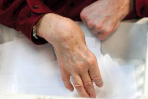 Chuck Davis uses a specialized basket and shredder to shred papers at Frontier Community Services, a non-profit organization dedicated to helping disabled individuals remain active and involved in their community. (Photo bu Kat Sorensen/Peninsula Clarion)