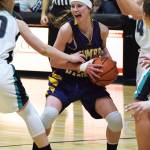 Homer&rsquo;s Alyssa Cole grabs a rebound Saturday against Nikiski at Nikiski High School. (Photo by Joey Klecka/Peninsula Clarion)