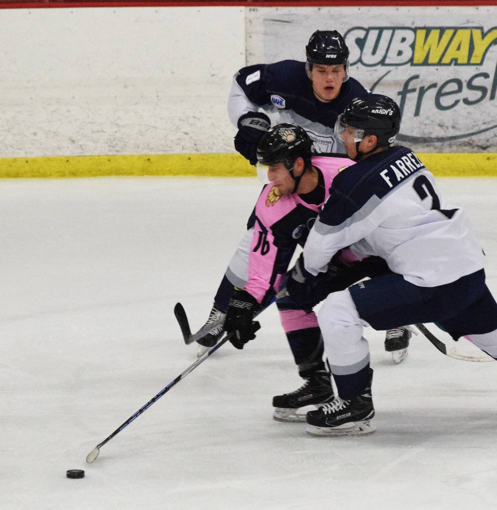 Kenai River&rsquo;s David Kaplan battles for the puck with Wilkes-Barre/Scranton skater Thomas Farrell (2) Friday night at the Soldotna Regional Sports Complex. (Photo by Joey Klecka/Peninsula Clarion)