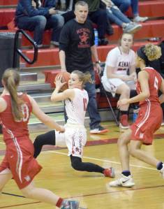 Kenai Central&rsquo;s Hayley Maw works against the Wasilla press Wednesday, Feb. 14, 2018, on Cliff Massie at Kenai Central High School. (Photo by Jeff Helminiak/Peninsula Clarion)