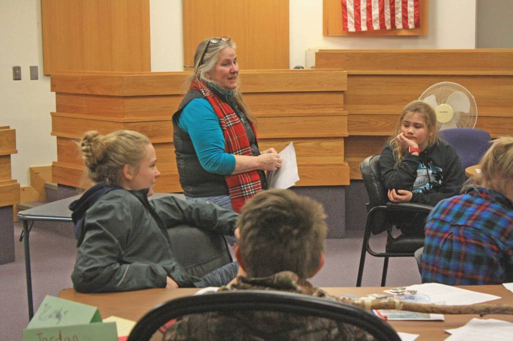 Kenai Peninsula Youth Court Director Ginny Espenshade discusses legal principles with students at the Old Kenai Courthouse on Jan. 30. A diversion program for youth offenders, the youth court allows youth facing certain misdemeanor charges to have their cases heard before peers. (Photo by Erin Thompson/Peninsula Clarion)