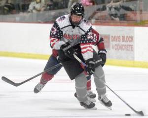 Kenai River Brown Bears forward Luke Posner brings the puck up the ice against the Fairbanks Ice Dogs on Nov. 3, 2018, at the Soldotna Regional Sports Complex. (Photo by Jeff Helminiak/Peninsula Clarion)