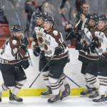 Brown Bears forward Gil Garcia (far left) celebrates his power-play goal in the first period Friday, Feb. 16, 2018, at the Soldotna Regional Sports Complex. (Photo by Jeff Helminiak/Peninsula Clarion)