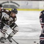 Kenai River Brown Bears forward Sacha Guillemain carries the puck into the zone against the Johnstown (Pennsylvania) Tomahawks on Friday, Feb. 16, 2018, at the Soldotna Regional Sports Complex. (Photo by Jeff Helminiak/Peninsula Clarion)