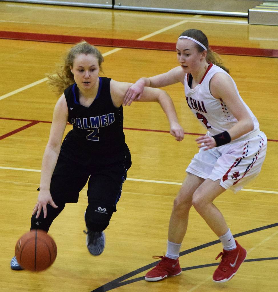 Palmer&rsquo;s Abrianna Busbey (left) looks for space against Kenai&rsquo;s Jaycie Calvert Friday night at Kenai Central High School. (Photo by Joey Klecka/Peninsula Clarion)