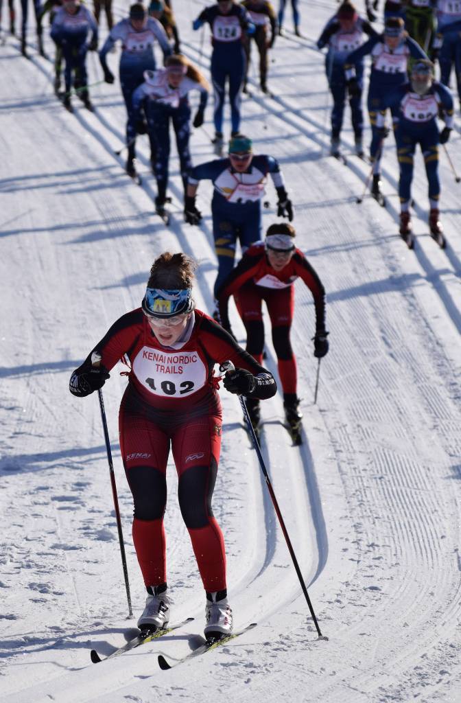 Kenai Central&rsquo;s Addison Gibson (102) leads the girls field up an early hill Saturday afternoon at the Region III skiing championships at the Tsalteshi Trails in Soldotna. (Photo by Joey Klecka/Peninsula Clarion)