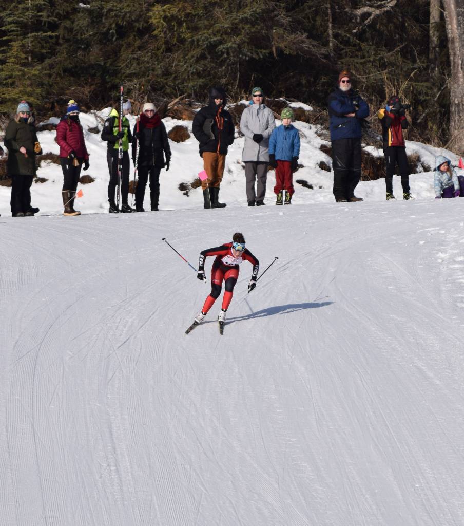 Kenai Central racer Addison Gibson works her way down the final hill of the girls race Saturday afternoon at the Region III skiing championships at the Tsalteshi Trails in Soldotna. (Photo by Joey Klecka/Peninsula Clarion)