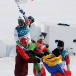 German Madrazo, of Mexico, holds up his countries flag after finishing last in the men&rsquo;s 15km freestyle cross-country skiing competition at the 2018 Winter Olympics in Pyeongchang, South Korea Feb. 16. (AP Photo/Dmitri Lovetsky)