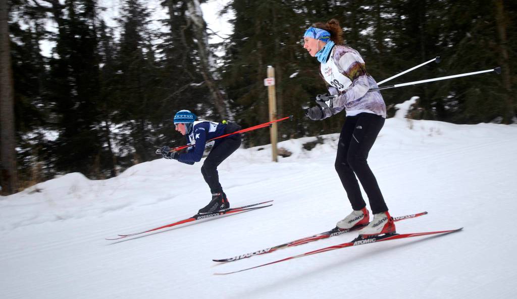 Skiers Tara Schmidt (near) and Ryder Giesler descend the Rabbit hill during the first annual Tour of Tsalteshi ski race on Sunday, Feb. 18, 2018 near Soldotna, Alaska.