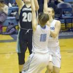 Nikiski&rsquo;s Bethany Carstens goes up for a shot against Soldotna&rsquo;s Aliann Schmidt and Denali Wurst on Tuesday, Feb. 20, 2018, at Soldotna High School. (Photo by Jeff Helminiak/Peninsula Clarion)
