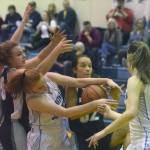 Nikiski&rsquo;s Bethany Carstens, Soldotna&rsquo;s Kianna Holland, Nikiski&rsquo;s Rylee Jackson and Soldotna&rsquo;s Danica Schmidt battle for a rebound Tuesday, Feb. 20, 2018, at Soldotna High School. (Photo by Jeff Helminiak/Peninsula Clarion)