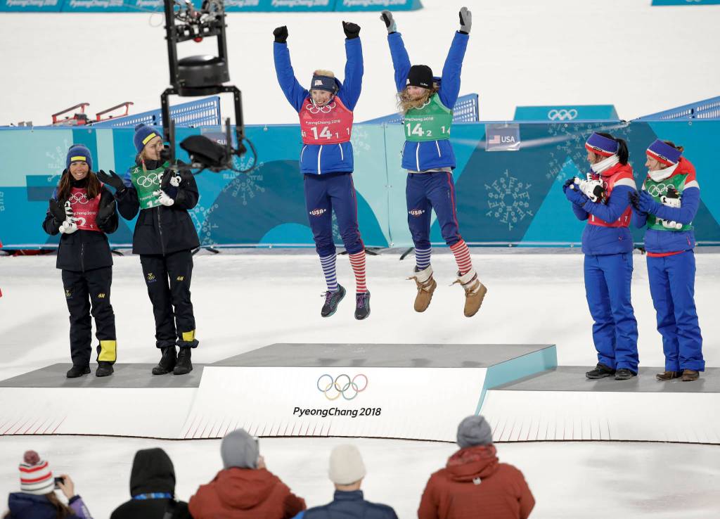 Gold medal winners Kikkan Randall, of the United States, and Jessica Diggins is flanked by silver medal winners Stina Nilsson, of Sweden, and Charlotte Kalla, left, and bronze medal winners Marit Bjoergen, of Norway, and Maiken Caspersen Falla during the venue ceremony after women&rsquo;s team sprint freestyle cross-country skiing final at the 2018 Winter Olympics in Pyeongchang, South Korea, Wednesday, Feb. 21, 2018. (AP Photo/Dmitri Lovetsky)