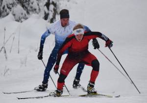 Kenai Central&rsquo;s Karl Danielson leads Soldotna&rsquo;s John-Mark Pothast up Kill Bill hill Nov. 21, 2017, at the Turkey Skate race on the Tsalteshi Trails in Soldotna. (Photo by Joey Klecka/Peninsula Clarion)