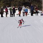 Kenai Central racer Addison Gibson works her way down the final hill of the girls race Feb. 17, 2018, at the Region III skiing championships at the Tsalteshi Trails in Soldotna. (Photo by Joey Klecka/Peninsula Clarion)