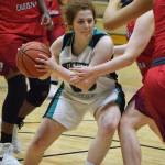 Nikiski&rsquo;s Angela Druesedow cuts through a swarm of ACS defenders Friday at Nikiski High School. (Photo by Joey Klecka/Peninsula Clarion)