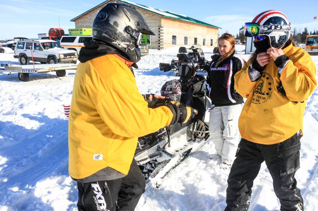 Riders return from a 50-mile loop of the Caribou Hills as part of the WOW fundraiser for cancer patients held on Saturday, Feb. 24, 2018 near Ninilchik, Alaska. (Photo by Erin Thompson/Peninsula Clarion)