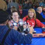 Participants in the Way Our Women Ride fundraiser enjoy food and friends at Freddie&rsquo;s Roadhouse on Saturday, Feb. 24, 2017 near Ninilchik, Alaska. (Photo by Erin Thompson/Peninsula Clarion)