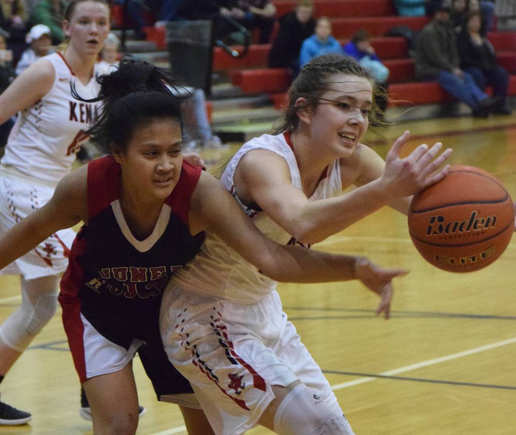 Juneau&rsquo;s Alyxn Bohulano (right) tries to swipe the ball from Kenai&rsquo;s Brooke Satathite Saturday at Kenai Central High School. (Photo by Joey Klecka/Peninsula Clarion)