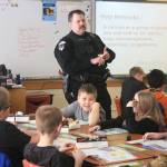 Soldotna Police Officer Tobin Brennan discusses a D.A.R.E. lesson on &ldquo;help networks&rdquo; with fifth-grade students at Soldotna Elementary School on Wednesday, Feb. 28. (Photo by Erin Thompson/Peninsula Clarion)