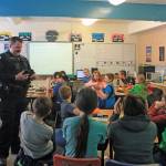 Soldotna Police Officer Tobin Brennan quizzes fifth-graders on D.A.R.E. glossary terms during a lesson at Soldotna Elementary School on Feb. 28. (Photo by Erin Thompson/Peninsula Clarion)