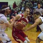 Kenai&rsquo;s Luke Beiser (middle) cuts through the Soldotna defense for a layup Saturday night at Soldotna High School. (Photo by Joey Klecka/Peninsula Clarion)