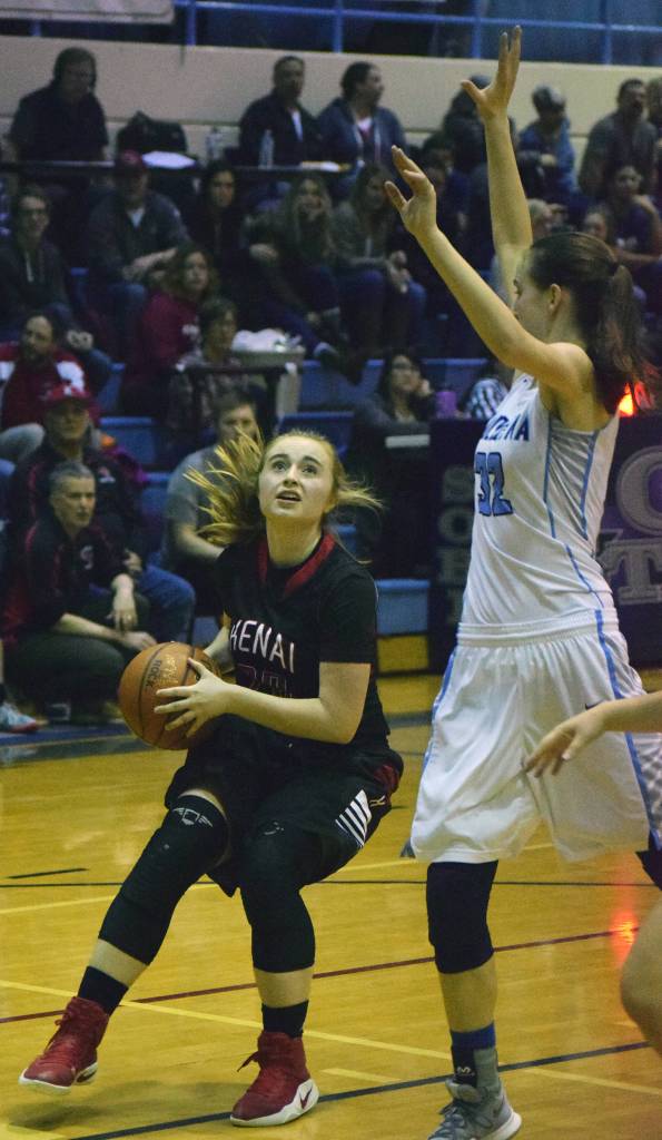 Kenai&rsquo;s Liz Hanson dribbles for a shot against Soldotna&rsquo;s Danica Schmidt (right) Saturday night at Soldotna High School. (Photo by Joey Klecka/Peninsula Clarion)