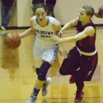 Soldotna&rsquo;s Danica Schmidt (left) looks for an open teammate with Kenai&rsquo;s Hayley Maw guarding her Saturday night at Soldotna High School. (Photo by Joey Klecka/Peninsula Clarion)