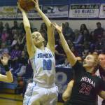 Soldotna&rsquo;s Aliann Schmidt grabs a rebound over Kenai Central&rsquo;s LIz Hanson (20) Saturday night at Soldotna High School. (Photo by Joey Klecka/Peninsula Clarion)