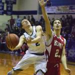 Soldotna&rsquo;s Jersey Truesdell (right) puts up a shot against Kenai&rsquo;s Luke Beiser Saturday night at Soldotna High School. (Photo by Joey Klecka/Peninsula Clarion)